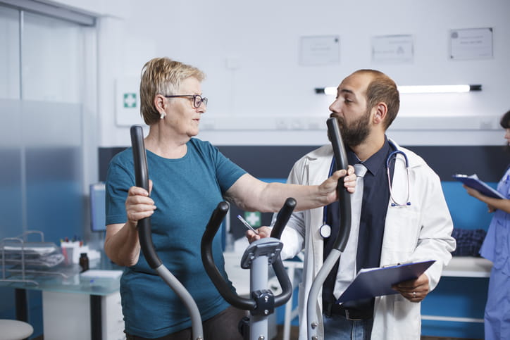 Elderly patient engages in physiotherapy