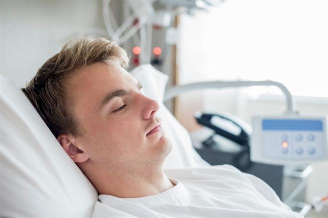 Man sleeping in hospital room