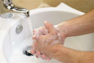 Close up on person washing their hands in the sink Close up on person washing their hands in the sink
