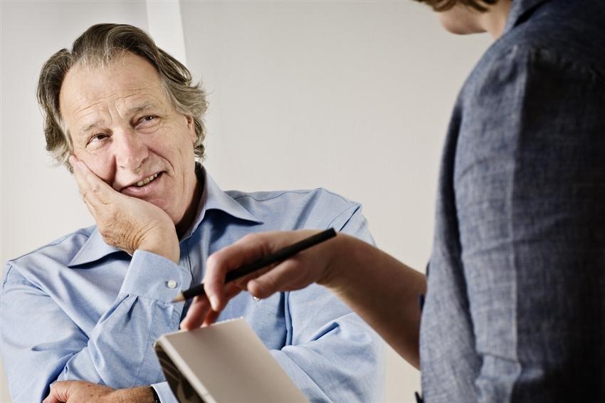 Older gentleman talking with a counselor
